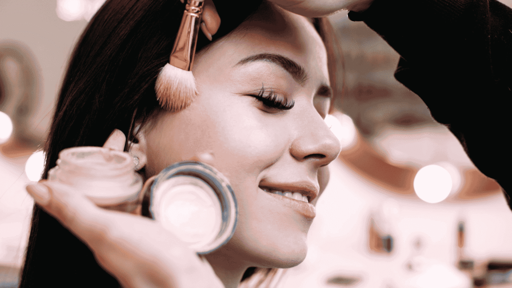 Dubai makeup artist applying face powder during a home appointment