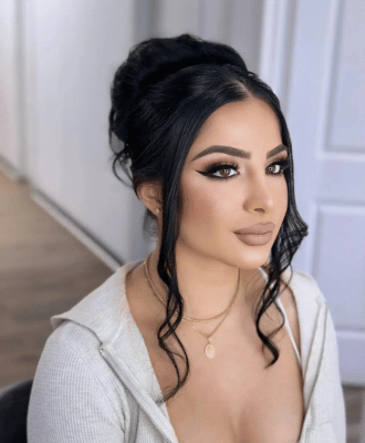 client picture after getting ready from makeup and hair services at home