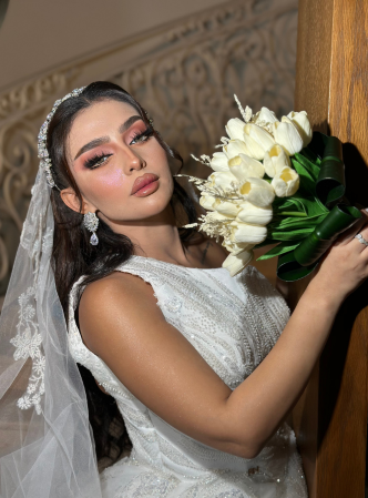 bridal makeup in Dubai with soft pink glam and long waves by Pink Soul