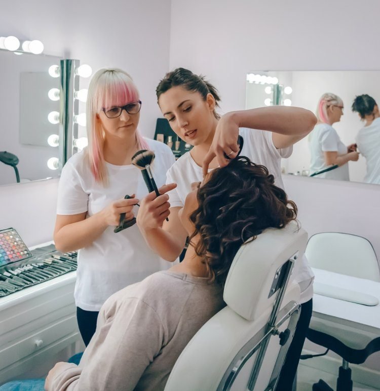 Makeup artist doing client makeup appointment